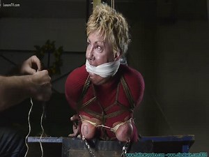 Executioner doing boobs bondage