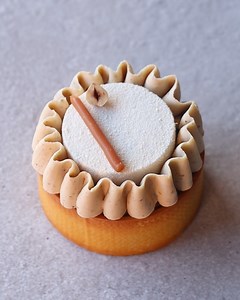 I thought I would get creative, by using a silicon tuile stencil to create a really fun texture on the bottom of my tart shell. I filled it with a coffee hazelnut financier, soft caramel, crunchy feuilletine, and topped with a cream cheese mousse. I finished it with some decorative piping using a whipped coffee ganache! | Matt Adlard