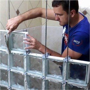 Fernando creating a bathroom glass block wall | MetDaan DIY