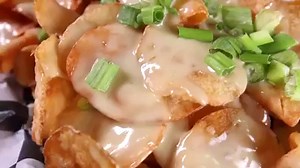 Potato chips are even better topped with melted cheese. | Phantom Gourmet