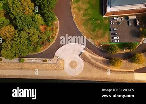 Quay of the river with pedestrian zone and green park. Roads leading to the Fort Duquesne Bridge in Pittsburgh, Pennsylvania, USA. Aerial view.
