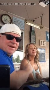 mature woman shows her tits to the public with her friends