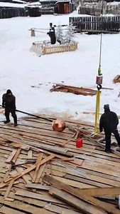 Installation of the cross. | Taiga Log Homes