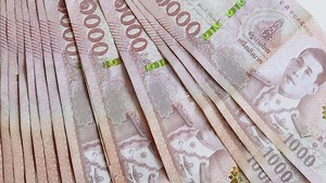 Thai 1000 baht banknotes stacked together. Close-up, Money, Cash, symbolizing wealth, money, economy, business, and financial success