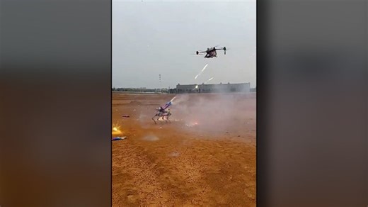 Video shows futuristic clash between a drone and a robot, fiercely launching fireworks at one another. | The Register-Guard