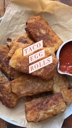I love making egg rolls. The possibilities of what you can fill them with are endless. Today I’m going very simple by making taco egg rolls with taco meat and shredded cheese. Serve alongside salsa, guacamole and sour cream and you have a regular party on a plate! . . . Taco Eggrolls . . 1 pound lean ground beef 1 onion, chopped 1 red pepper diced 2 cloves garlic chopped 1 package taco seasoning plus water as per package 1/4 cup salsa 1/4 cup chopped cilantro 20 egg roll wrappers 2 cups shredded