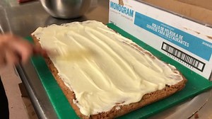 Making that Sad Cake! Sad Cane is our version of a brown sugar blonde brownie filled with pecans and topped with cream cheese icing. It's called Sad Cake because you will be sad when it's all gone. So be sure to grab an extra slice to take home! | Rusty Pig BBQ