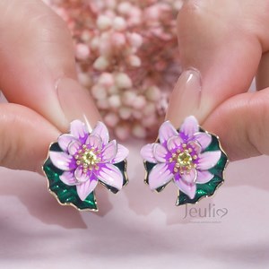 Wear these beautiful lifelikelotus flower and leaf enamel earrings with almost anything. Shop them here: https://jeulia.io/9ta0 | Jeulia