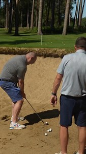 ( TWO STEP PROCESS ) Improving Consistency 📈 In this scenario, we’re 12 yards from the pin and need both height and spin to clear the lip of the bunker and get the ball close to the hole. To improve consistency, our first step was to master our set-up basics and then focus on perfecting our swing… SET-UP AND SWING BASICS 1️⃣ Stand further from the ball and squat down 2️⃣ Position the ball just inside your lead foot 3️⃣ Keep your triceps locked onto your chest! For more on this shot, check out t