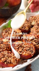 Air Fryer Peaches 🍑Recipe below! You will LOVE these Air-Fryer Peaches a mix between caramelized peaches and peach crisp, with soft, juicy, warm peaches topped with a crunchy granola-like topping. They are vegan and gluten-free, and you will love the natural sweetness of warm peaches. | The Conscious Plant Kitchen