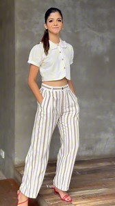 Striped Linen Pleated Pants - Rs. 3,690.00 Ruffle-collared Button Detail Crop - Rs. 2,790.00 #FashionForward #SummerOutfit #OOTD #TrendyLook #yarnanddarn | Yarn & Darn