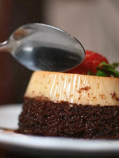 Indulge in the best of both worlds with our choco-flan delight 🍫🍮✨ A perfect blend of silky flan and rich chocolate brownie, crowned with a fresh strawberry on top. Treat yourself to a sweet Cuban escape. 📍 215 S Woodland Blvd, DeLand, FL #ChicasCubanCafe #CubanDesserts #SweetIndulgence | Chica's Cuban Cafe