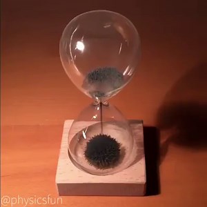 14K views · 84 reactions | Magnetic Sand Hourglass. Ferromagnetic sand collects above a neodymium magnet in the wood base. Each particulate of ferromagnetic iron becomes a temporary dipole magnet in the presence of the magnetic field in the base. | Gốm Sứ Tuyển Chọn | Facebook