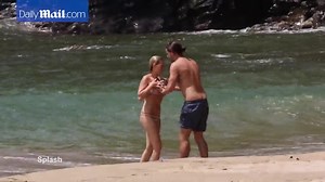 Margot Robbie splashes on the beach with husband Tom Ackerley