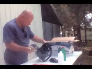 lending a hand to a saw newbie.assembling his wemars chainsaw