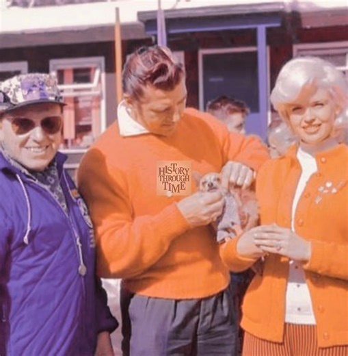 "Jayne Mansfield and her husband, Mickey Hargitay, are photographed in Rome during the 1960 Summer Olympics, radiating star power and charm. The glamorous couple, both icons of the era, drew attention as they strolled through the Eternal City, blending Hollywood flair with the international excitement of the Games. Mickey, a former Mr. Universe, and Jayne, known for her dazzling screen presence, embraced the celebratory spirit of the Olympics. Their appearance in Rome highlighted their shared lo