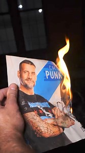 Drew McIntyre burning an autographed picture of CM Punk. | Pro Wrestling Feed
