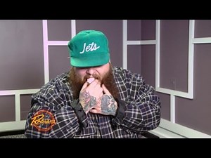 Action Bronson Enjoys Gourmet Snacks Backstage In His Signature Style.