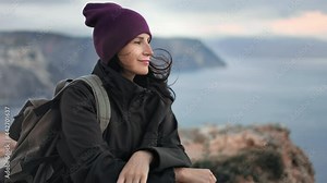 Pleasant traveler hipster woman contemplating ea scenery mountain peak freedom inspiration