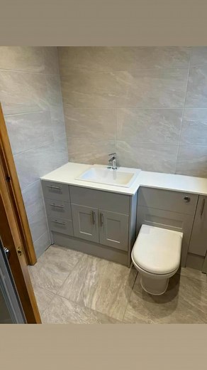 Hitchin bathroom finished Bath out Shower tray on the floor for easy access 60x60 porcelain floor tiles 60x30 wall tiles Fitted furniture | Craig bryder plumbing and heating