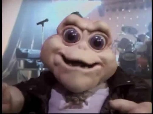 "I'm the Baby (Gotta Love Me)" is Baby Sinclair's personal anthem, written for the Dinosaurs album Big Songs. Featuring the vocal talents of Kevin Clash and Staurt Pankin. A music video appeared on Dinosaurs, closing out the third season episode "Little Boy Boo" as a stand-alone segment. Baby interrupts the DTV host in order to perform his own number. He sings his own praises and explains why it is compulsory to love the baby. A dinosaur rock band provides back up, and the rest of the Sinclair F