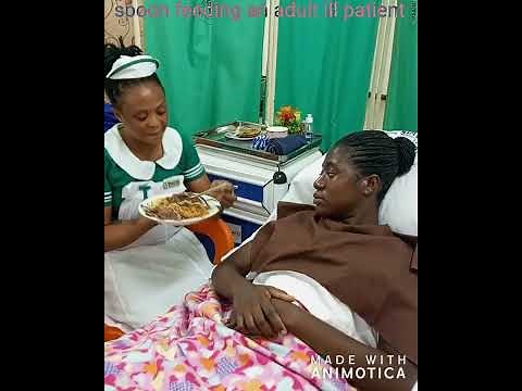 spoon feeding an adult ill patient ‪@nursingart247‬