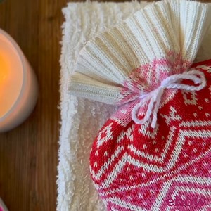 Stay warm and comfy with this homemade hot water bottle cover, which calls for simple sewing skills and an upcycled sweater. DIY: https://www.ehow.com/13778775/sweater-hot-water-bottle-cover?utm_source=facebook.com&utm_medium=referral&utm_content=freestyle&utm_campaign=fanpage | ehow