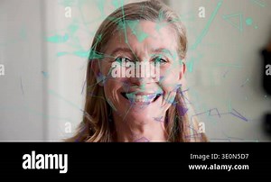 Woman facing camera smiling while teal shapes drifting over face causing laughter, showing design. Portrait, adult, polygonal, overlay, abstract, geometric, purple Stock Video Footage - Alamy