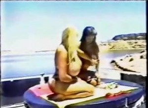 Two women catch the sunlight on a boat ...