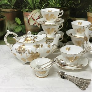 Hammersley Golden Cornflower Tea Set - - - - In honour of International Tea Day, May 21, 2023….Hammersley bone china “Golden Cornflower” tea and coffee service, beautifully gilded on bone china. Made in England, mid 20th century, inspired by late Georgian tea ware shapes. This set is in immaculate condition, complete with tea and coffee pots, creamer, sugar and 6 cups and saucers. Planning a High Tea, or a bridal shower? Do it with panache! More photos, pricing and full description available by 