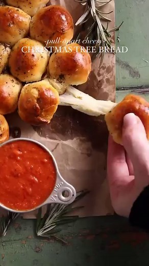 PULL-APART CHEESY BREAD shaped like a Christmas tree by @healthylittlepeach is a 20-minute appetizer. Each bread bite is filled with cheese and topped with garlic butter. Get the full recipe @thefeedfeed link in bio and keep tagging #feedfeed for a chance to be featured. easy recipe, how to make pull apart bread, christmas time, christmas tree, festive foods, holiday baking, holiday season, fun christmas party appetizers, christmas food | Feedfeed