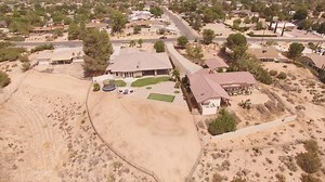 JUST LISTED $449,900. 18289 Orange St. Hesperia CA 92345. TRULY CUSTOM one-of-a-kind home with THE MOST AMAZING VIEWS of Hesperia Golf Course, the city & mountains. So many custom features that you must view in person. 4-CAR ATTACHED GARAGE, front & rear landscaping that includes a chipping & putting green, custom elevated fire-pit area with stacked stone accents, mature palm trees & more. As you walk through the large custom wood door the tall ceilings and stamped & stained concrete floors that