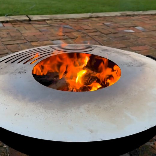 Unwind in style with Tiny Anvil's Fire Pits, Bowls, and Chimineas. Picture yourself enjoying a glass of wine by the warm glow of the fire—it's the perfect way to end the day. Crafted from robust 4mm Corten steel, our fire features add a touch of luxury and elegance to your outdoor space. • Perfect for relaxing evenings or intimate gatherings • Durable design that ages beautifully with time • Stainless steel top ideal for cooking your favorite meals • Create memorable moments under the stars | Ti