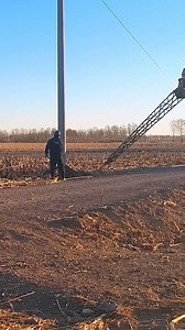 The telegraph pole was strung with wires. | Giant Machines