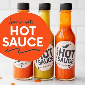 You can't beat the spicy, layered flavor of homemade hot sauce. It's a fun kitchen experiment that you can completely customize—make it mild or make it hot as can be! Then bottle it up using our free labels to give away as a thoughtful, handmade food gift. Get the Full Recipes Here >>> https://wholefully.com/homemade-hot-sauce-recipe/ | Wholefully