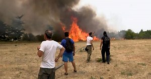 Greece fires claim first deaths as pressure builds on Turkey