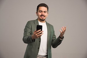 A businessman in dress code having a video call.  | Free Photo