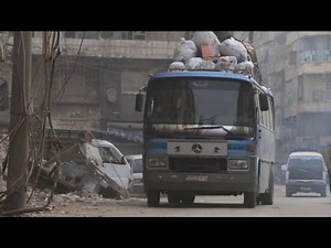 Buses brave 'road of fear' in Syria's divided Aleppo