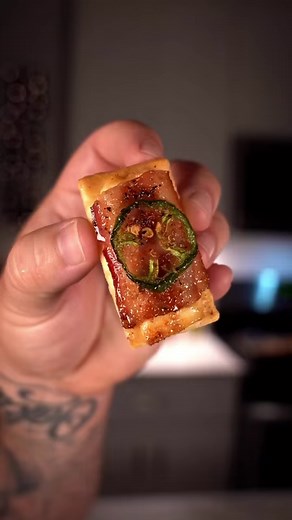 The tastiest appetizer to cook on your pellet grill 🥓🍯🤯 Save this one for later to try for your holiday dinner parties! Recipe from Foodwithbearhands below ⤵️⤵️⤵️ This hands down is the best appetizer and easiest cook I’ve ever made, and it only takes 30 minutes 🤯👊🏼 How to: Lay out crackers on a cooking sheet Top with cream cheese Top with your favorite sweet rub Top with bacon 🥓 Top with a slice of jalapeño Then top with more rub In the smoker or oven at 350 degrees For 30-35 minutes unt
