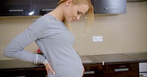Pregnant Young Woman Standing in Her Kitchen Stock Video - Video of indoor, girl: 50037757