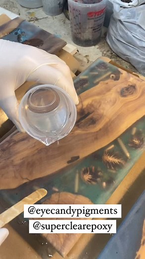 Had to redo this one too! Olive wood can be very tricky due to the sheer amount of cracks and crevices present in the wood. It causes dimples to appear in the flood coat. Yes we could just sand it down and polish it but that’s a pain in the neck. Also sometimes the outer edges are very thin with epoxy and you take a risk of exposing the wood and that’s not what we want with these projects. Olive wood combined with Table Top and Liquid Glass deep pour epoxies by @superclearepoxy colored with Rain