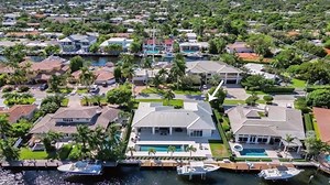 Presented by Chris & Connie Williams RE/MAX Preferred Phone: 9548302242 www.WilliamsGroupFTL.com Waterfront Living in Coral Ridge featuring stunning views! Enjoy floor to ceiling (13 ft) sliders in the entire living spaces. Modern clean architecture, home built in 2018, all low-e glass. Full length 100 ft dock with 13,000 lb boat lift. Salt water lap pool (52') with sun shelf and spa. Large outdoor covered (tongue-in-groove ceiling) living space mimics the pool length. Natural gas powers the Blu