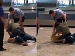 Moment 'drunk' woman fights with another woman on airport floor