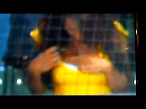 The Woman in the yellow shirt behind home plate at the Brewer game