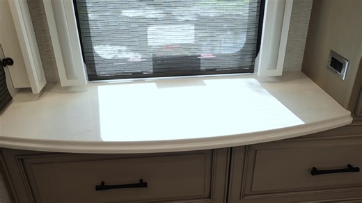 The Newmar London Aire 4551 takes luxury RV travel to an entirely new level. From its sleek black exterior to the bright white and beige interior, every inch is designed to impress. You’ll find granite countertops, a stunning backsplash, and matte black accents that create a refined, modern aesthetic. The LED TV on lift adds a touch of innovation, while the ample storage, walk-in shower, and double-sink bathroom ensure comfort and convenience wherever you go. With residential-style appliances, a