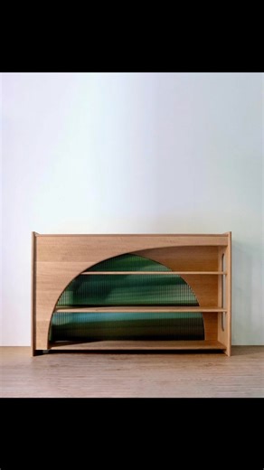 "The Franklin bookcase was the first in a line of furniture inspired by the architecture in Mary's hometown of Philadelphia. The Ben Franklin Bridge was the inspiration for this piece, which takes notes from the railing details, the curved and sweeping arches, the vertical cables, and the beautiful colour. This bookcase is made from white oak and acrylic." Designer maker: @kodamari.design Entered in Maker of the Year Awards, pre sented by Carbatec, Australian Wood Review's annual showcase for fi