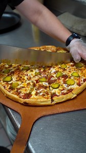 Looking for something new and exciting to try? Look no further than Happy Joe's Sloppy Joe Pizza! With 100% real ground beef, our special sloppy joe sauce, a blend of delicious cheeses, and garnished with classic dill pickles and yellow mustard, this pizza is sure to satisfy your cravings. Come try it out today! #HappyJoes | Happy Joe's Pizza