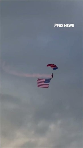WATCH: Patriot parachute team soars GIANT American flags into Cody Stampede Rodeo