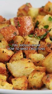 An essential topping for Caesar salad, these garlicky, herb-infused croutons are a great way to use up leftover bread. For exact measurements, ingredients, and detailed instructions, visit my website for the full written recipe! | Andrew Zimmern