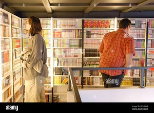 Views of Europe's first 'Manga Cafe' in Paris, France, on August 24, 2006. The venue, based on the Japanese concept combining a bookstore, a library and a cafe, opened its doors a few weeks ago in the heart of Paris (5th arrondissement). Fans can, for an hourly fee of 3 to 4 euros, have access to thousands of Mangas, surf the web, drink hot and cold soft drinks or play video games. Photo by Nicolas Khayat/ABACAPRESS.COM Stock Photo - Alamy